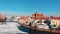 Red brick Oder riverbank wall and church in old town Wroclaw