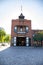 The red brick Plaza Firehouse surrounded by lush green trees at El Pueblo de Los Angeles Historical Monument with blue sky