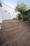 Red brick stairs at sloped street of Comares,Malaga, Spain