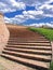 Red brick stairway with cloudy sky