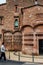 Red brick vintage building of Ca l`Ordal in La Colonia Guell in Barcelona, Spain