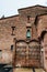 Red brick vintage building of Ca l`Ordal in La Colonia Guell in Barcelona, Spain