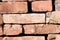 Red brick wall background with copy space. Used Rustic Bricks Piled.