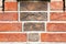 Red brick wall from bricks. Geometric background image from brown bricks. Compound with smooth brickwork