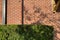 Red brick wall building shadows