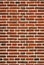 Red brick wall close up.