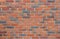 Red brick wall close up texture background, seamless