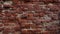 red brick wall of cracked grunge old orange bricks