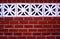 Red Brick Wall with Floral Concrete Blocks Close Up