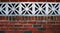 Red brick Wall with Floral Concrete Blocks Close Up