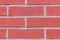 Red brick wall horizontal row rectangle stone cement stripes grunge style closeup background design base urban style