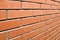 Red brick wall in perspective. Masonry brickwork background.