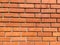 Red brick wall. Smooth silicate long bricks neatly laid out