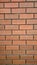 Red brick wall with smooth texture