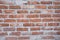 Red Brick Wall With Sprinkled White Plaster