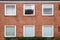 Red brick wall with square windows