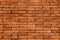 Red brick wall. The texture black stone blocks. Abstract background for design..