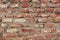 Red brick wall texture. Old rough orange brickwork background.