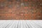 Red Brick wall texture surface with Wood terrace