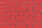 Red brick wall. Vector graphics. Background image of a brick wall.