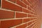 Red bricked wall in perspective