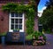 Red bricks house facade with window bench and flowers Naarden Netherland