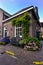 Red bricks house facade with window bench and flowers Naarden Netherland