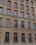 Red bricks and old peeling windows of an old industrial building