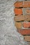Red bricks stone wall background closeup, cracked ruined stucco, vertical plastered grunge grey beige stonewall limestone pattern