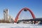 Red bridge over the frozen Moskva river, Moscow