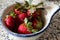 Red bright Strawberries in a bowl
