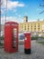 Red british phone booth and red street mailbox
