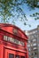 Red British Phone box with art deco building