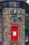 Red British Royal Mail Wall Post Box on Elm Row street, Hampstead, London