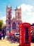 Red British telephone box in front of Westminster cathedral, London
