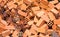 Red broken bricks. Industrial background. Construction site detail. Orange bricks messy pile