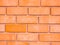 Red brown block brick wall Beautifully arranged texture backgrou