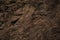 Red brown stone background. Rock surface. Mountain texture. Close-up.