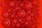 Red bubbles on same color gradient background. Blood molecules or abstract round particles.  Medical or biological concept pattern