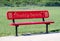 Red buddy bench on a playground