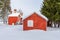 Red Buildings Under Deep Snow