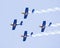 Red Bull display aerobatic team in a formation at Aero India Show 2013.