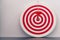 Red bullseye dart with red arrow