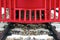 Red bumper of diesel train with black railway