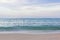 Red buoy on azure sea waves