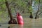 Red Buoy Floating in Flooded River