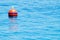 red buoy floating in the sea