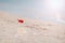 Red buoy lying on the seashell beach of Azov sea