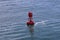 Red buoy in river