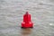 Red buoy in sea